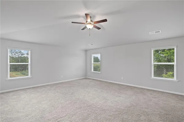 a white bath tub sitting next to a window