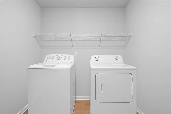 a view of a backyard with a garden and entertaining space