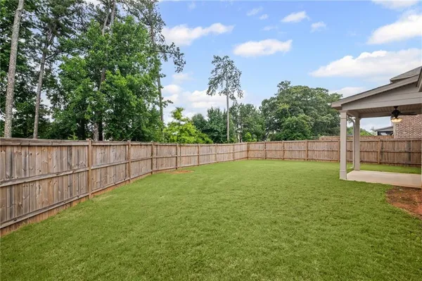 a view of a house with swimming pool and sitting area
