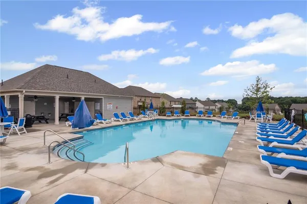 a view of a lake with a table and chairs