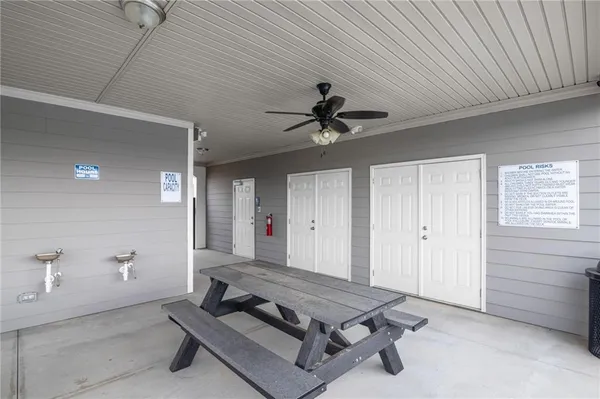 a view of a house with a big yard and a fountain