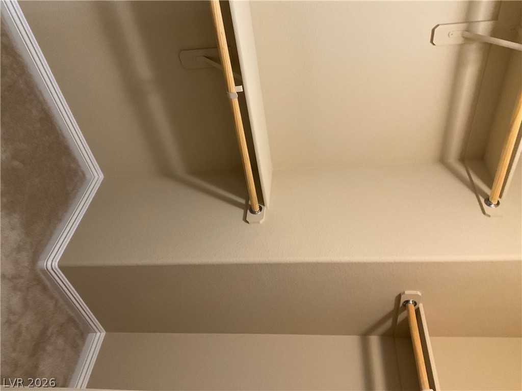 12 Jasmine Point Street Henderson, NV 89074 - Photo 7 of 15 Streamlined closet shelving and hanging rods offer abundant storage possibilities.