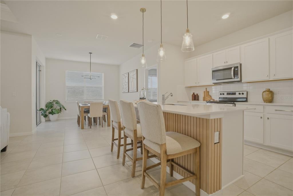 1821 Groveline Road St. Cloud, FL 34771 - Photo 11 of 36 a view of kitchen and dining area with furniture