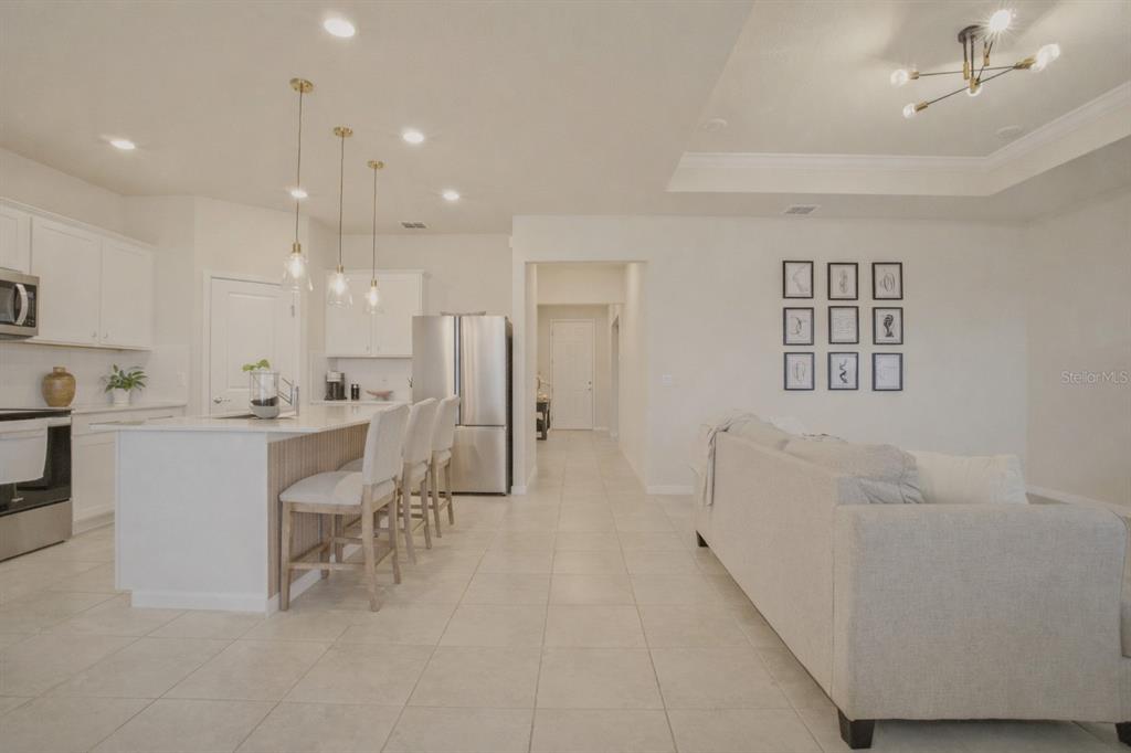 1821 Groveline Road St. Cloud, FL 34771 - Photo 16 of 36 a view of kitchen with furniture and refrigerator