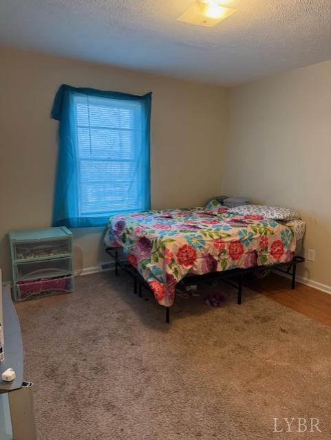 1822 Wards Ferry Road, Unit A&B Lynchburg, VA 24502 - Photo 21 of 31 a bedroom with a bed and a dresser