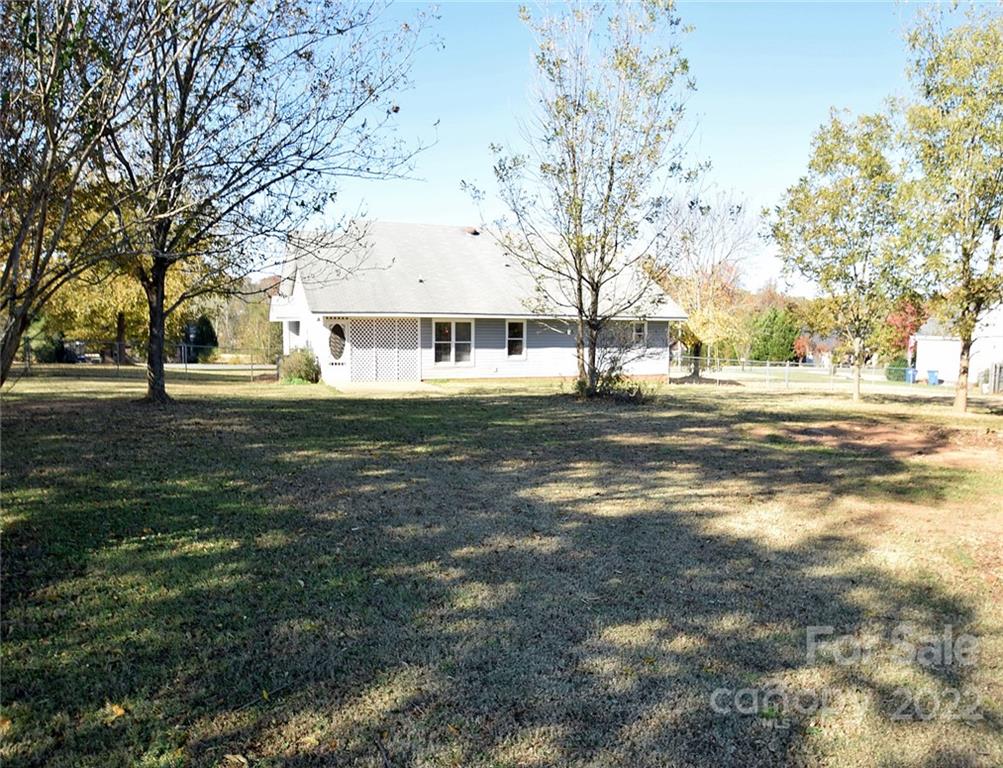 1909 Fletcher Broome Road, Unit 7 Monroe, NC 28112 - Photo 23 of 25 a view of a house with a yard