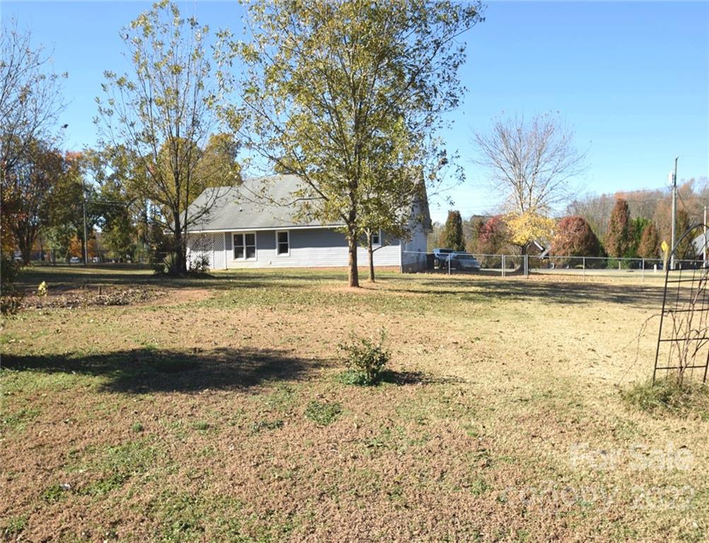 1909 Fletcher Broome Road, Unit 7 Monroe, NC 28112 - Photo 24 of 25 a view of a yard with an outdoor space