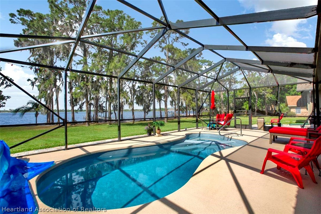 6801 Sparta Road Sebring, FL 33875 - Photo 27 of 36 a view of swimming pool with a patio