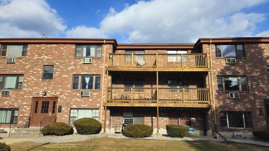 14 B Mayberry Drive, Unit 6 Westborough, MA 01581 - Photo 2 of 12 a view of house with outdoor space
