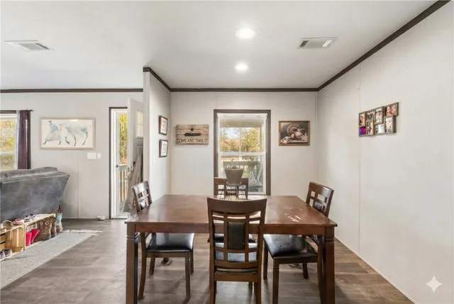 a view of kitchen with furniture and a refrigerator