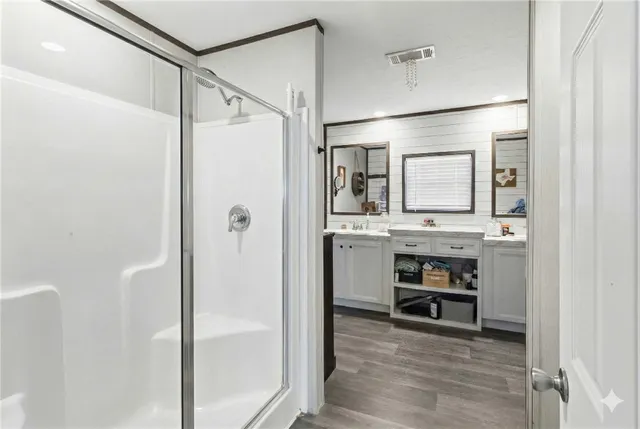 a bedroom with furniture and a chandelier