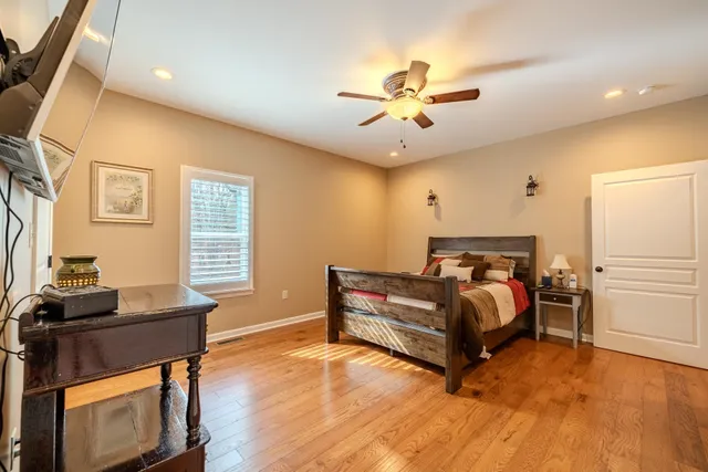 a bedroom with a bed and a table