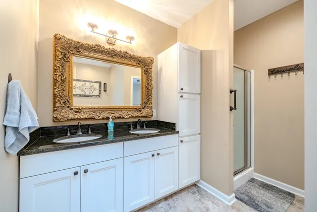 a bathroom with a sink and a mirror