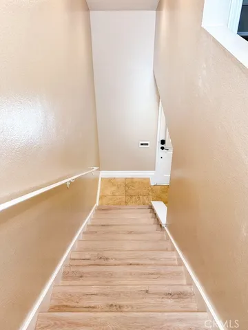 a view of wooden floor and staircase
