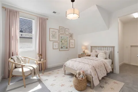 a bedroom with bed and a window