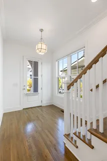 a view of an entryway with wooden floor
