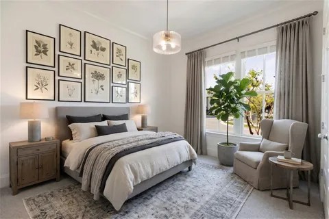 a bedroom with a large bed and a window
