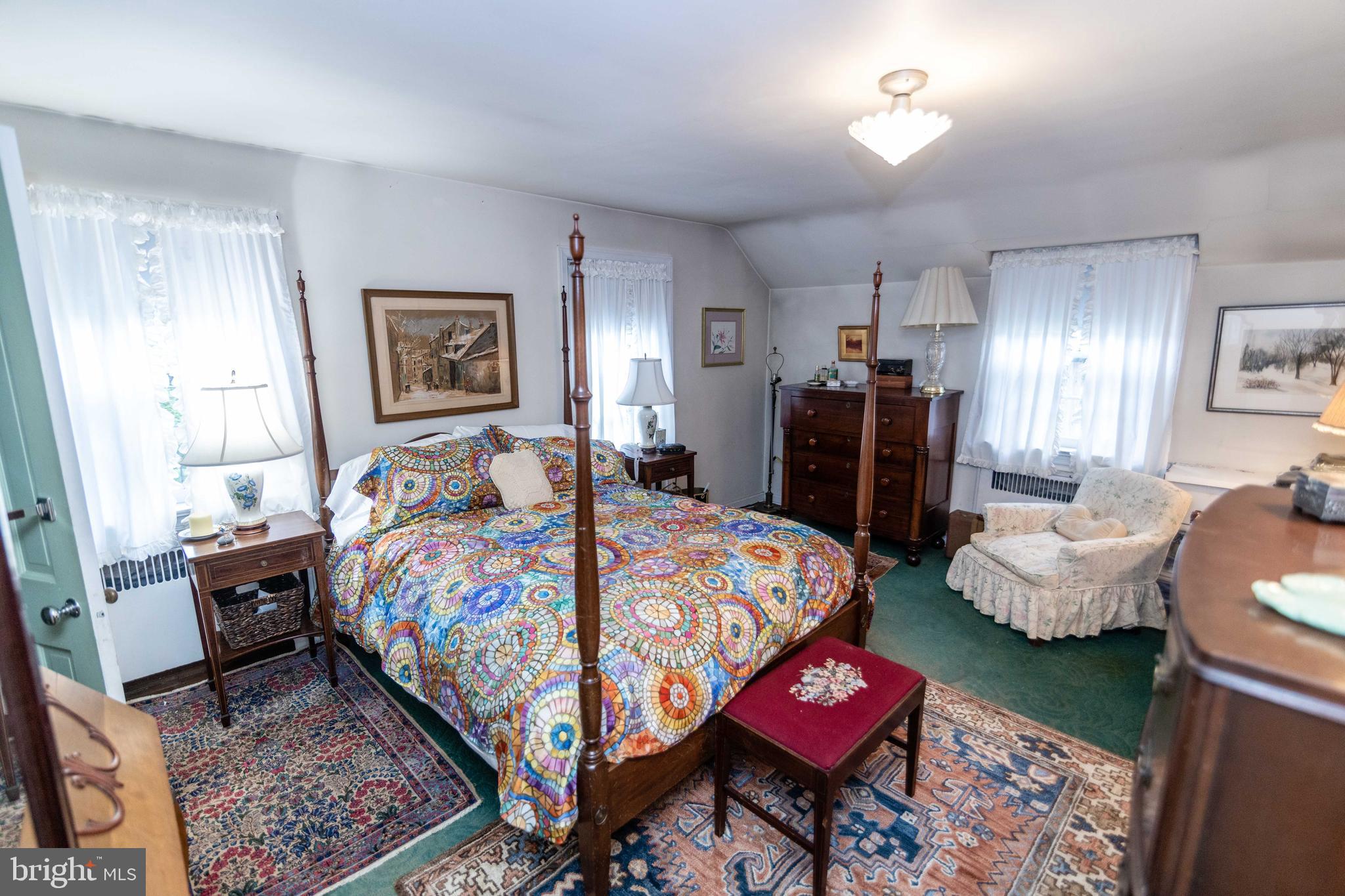 2 Green Valley Road Wallingford, PA 19086 - Photo 16 of 35 a bedroom with a bed and wooden floor