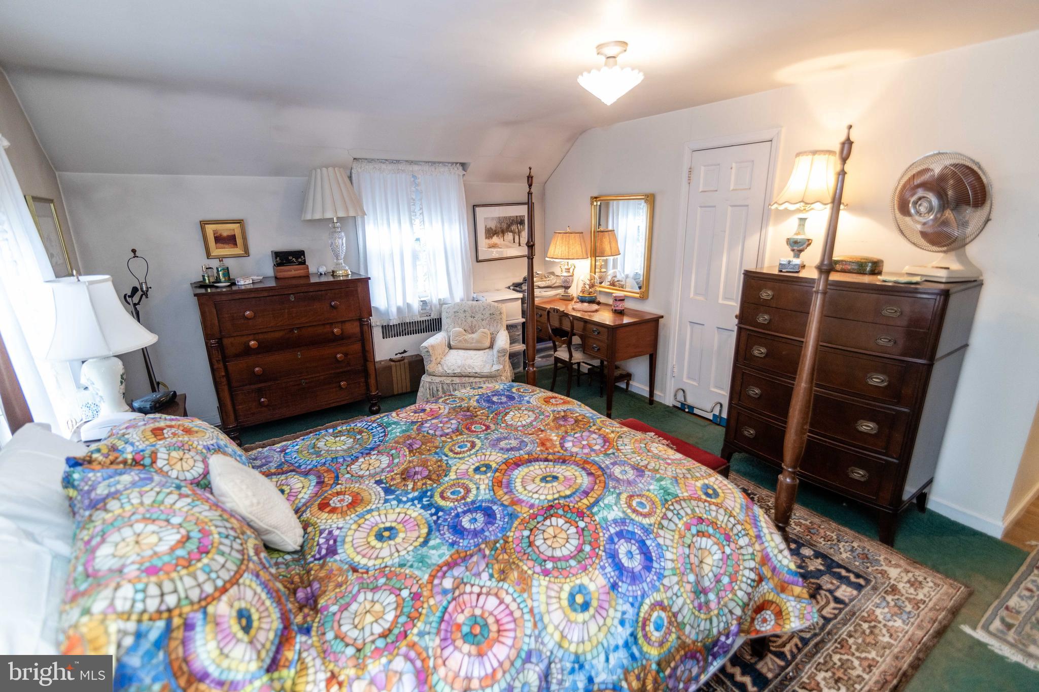 2 Green Valley Road Wallingford, PA 19086 - Photo 17 of 35 a bedroom with a bed and wooden floor