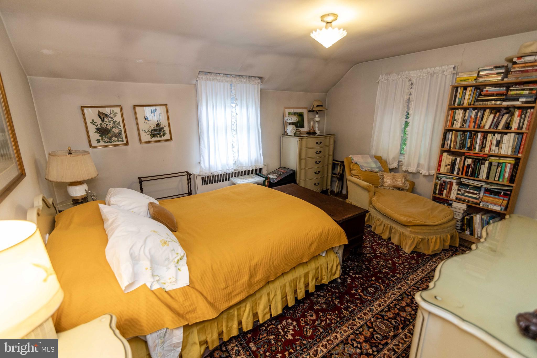 2 Green Valley Road Wallingford, PA 19086 - Photo 19 of 35 a spacious bedroom with a bed and wooden floor