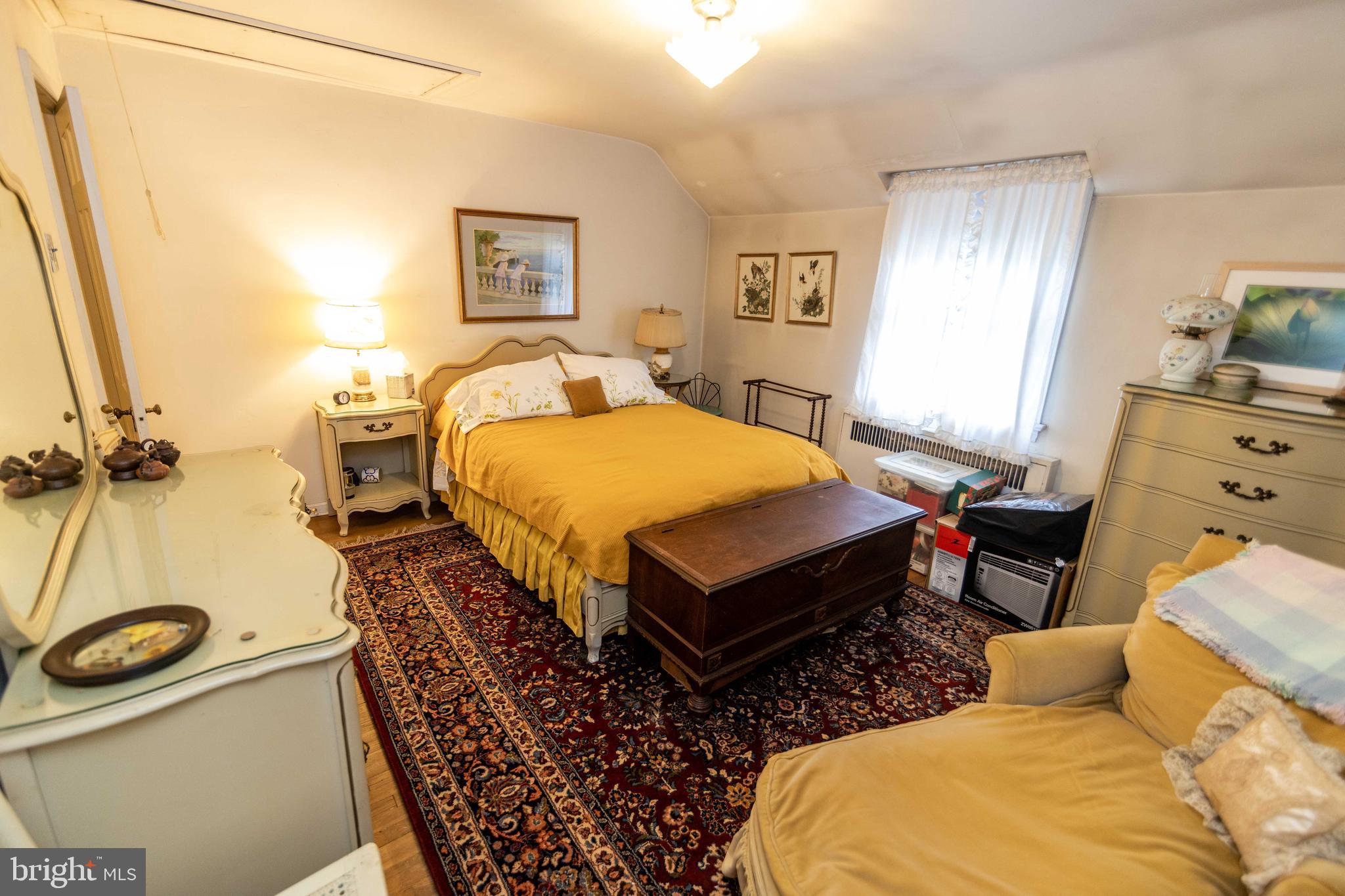 2 Green Valley Road Wallingford, PA 19086 - Photo 20 of 35 a bed room with a bed and two windows