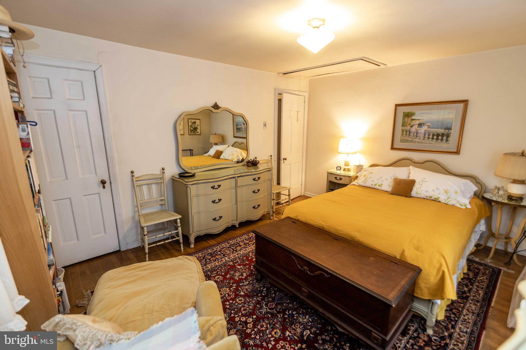 2 Green Valley Road Wallingford, PA 19086 - Photo 21 of 35 a bedroom with a bed and wooden floor