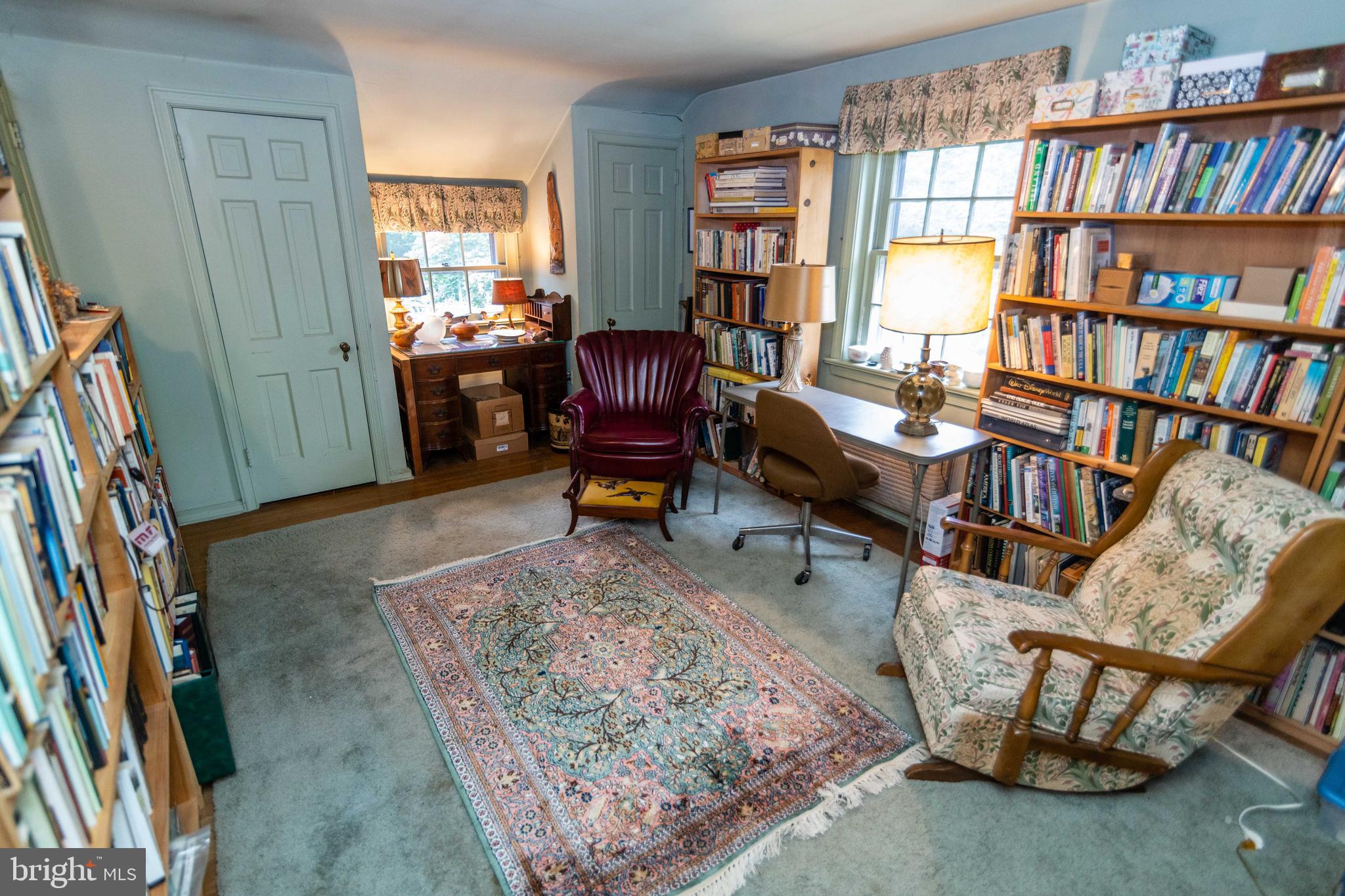 2 Green Valley Road Wallingford, PA 19086 - Photo 22 of 35 a living room with furniture and a book shelf