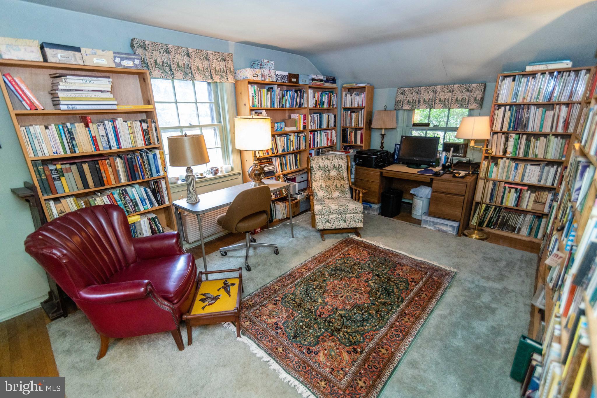 2 Green Valley Road Wallingford, PA 19086 - Photo 23 of 35 a living room with furniture and a book shelf