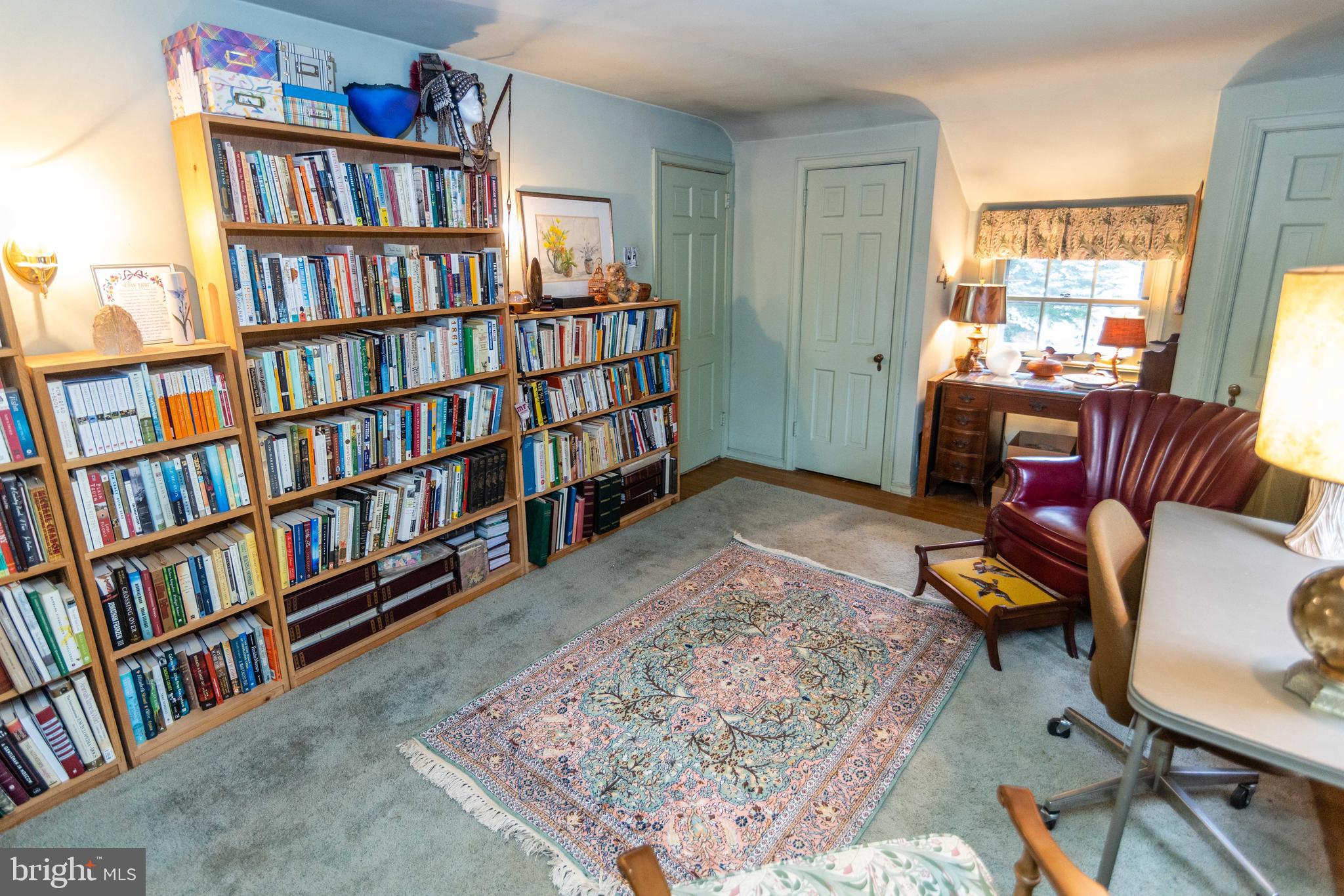 2 Green Valley Road Wallingford, PA 19086 - Photo 24 of 35 a living room with a book shelf and a book shelf