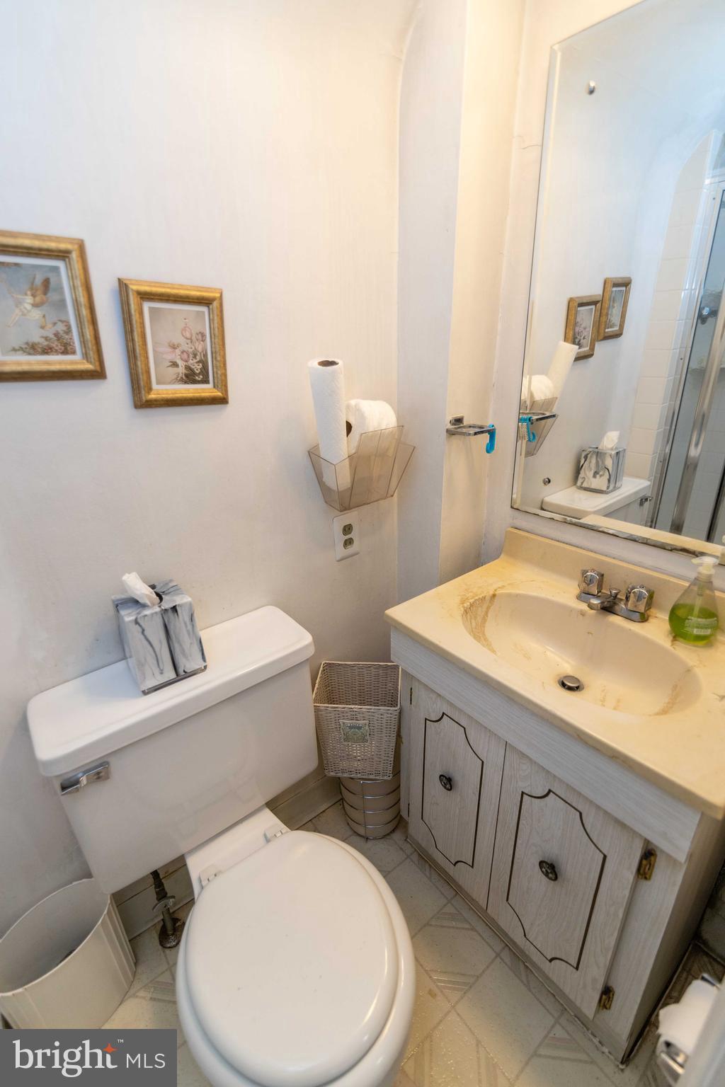 2 Green Valley Road Wallingford, PA 19086 - Photo 28 of 35 a bathroom with a toilet sink and mirror