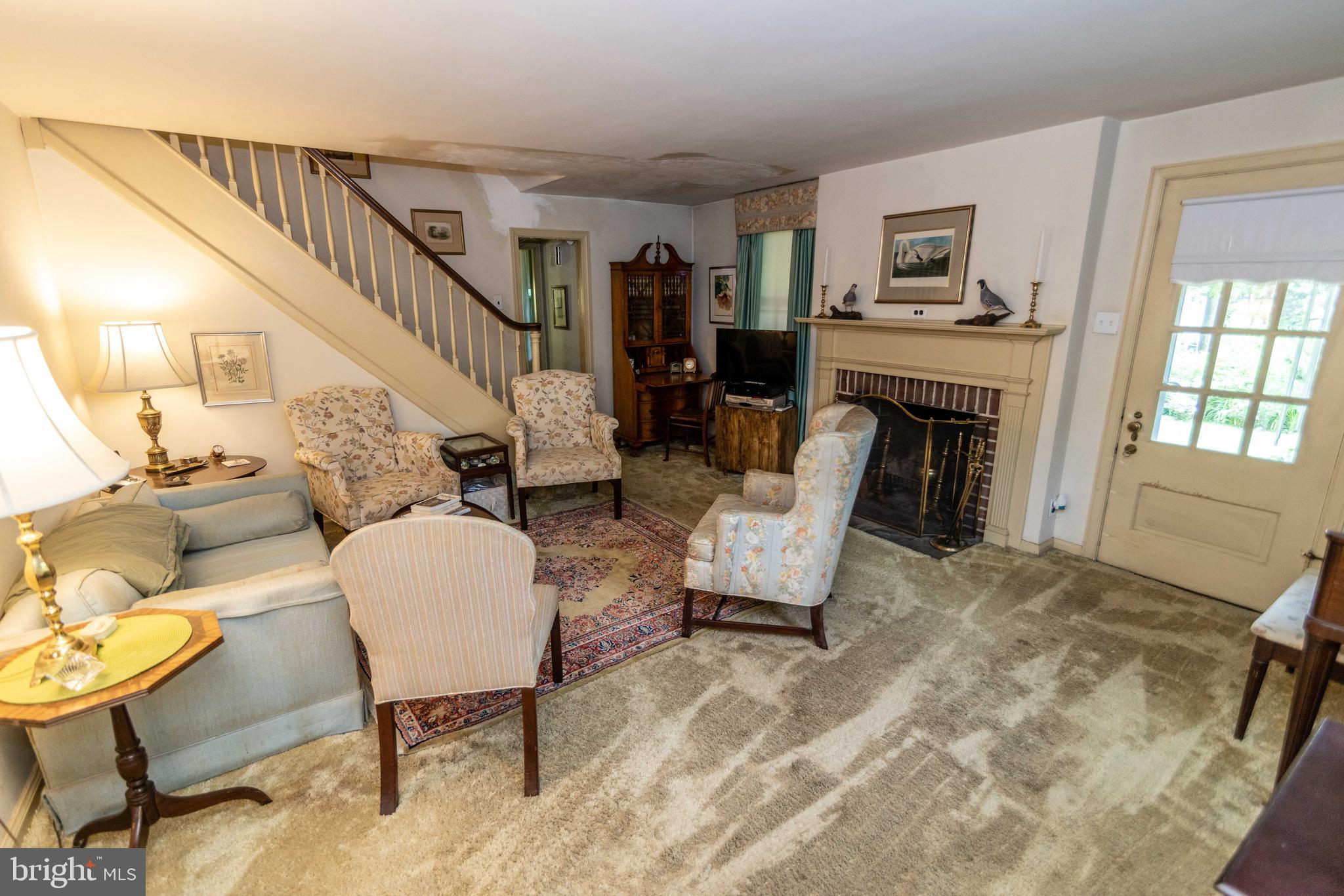 2 Green Valley Road Wallingford, PA 19086 - Photo 7 of 35 a living room with furniture and a fireplace
