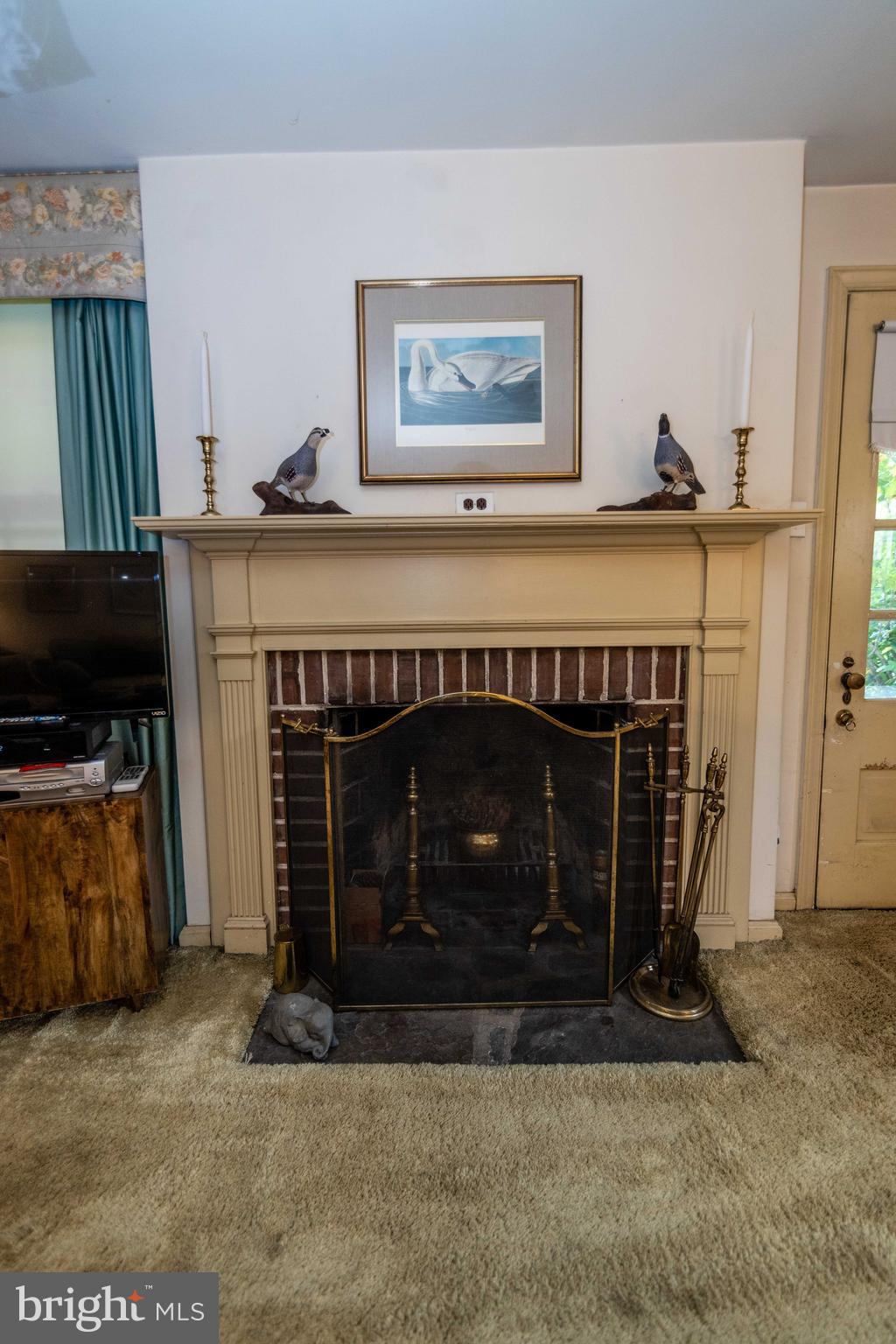 2 Green Valley Road Wallingford, PA 19086 - Photo 9 of 35 a living room with a fireplace furniture and a fireplace