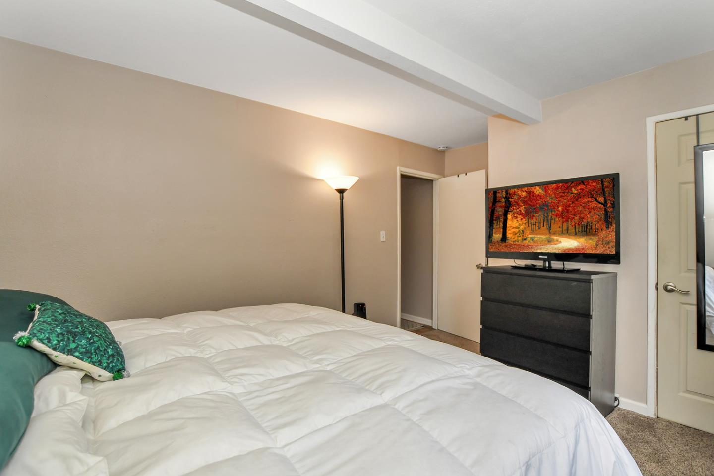 4298 Arthur Road Martinez, CA 94553 - Photo 15 of 32 a bedroom with a bed and a flat screen tv
