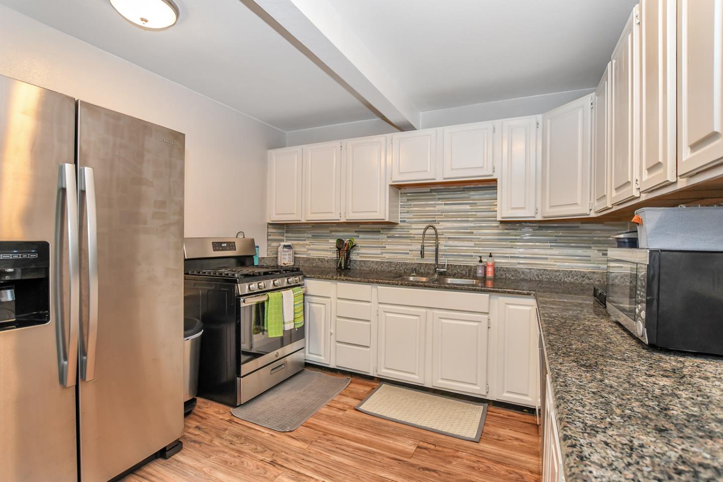 4298 Arthur Road Martinez, CA 94553 - Photo 23 of 32 a kitchen with granite countertop a refrigerator stove and sink