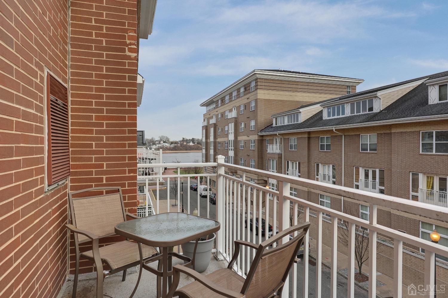368 Rector Street, Unit 417 Perth Amboy, NJ 08861 - Photo 18 of 27 a view of a chair and table in the balcony