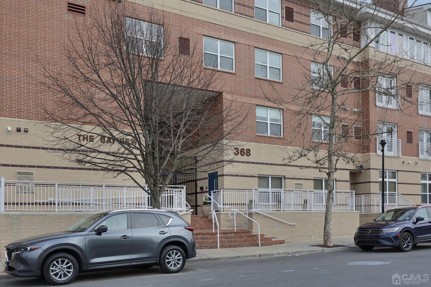 368 Rector Street, Unit 417 Perth Amboy, NJ 08861 - Photo 3 of 27 a car parked in front of a building