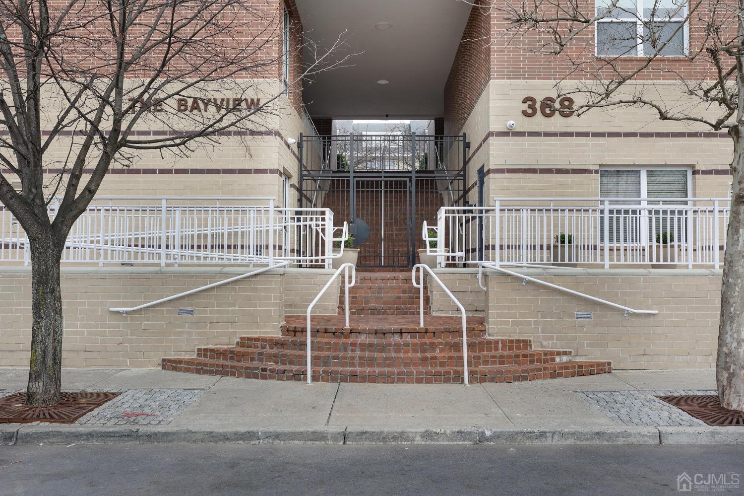 368 Rector Street, Unit 417 Perth Amboy, NJ 08861 - Photo 4 of 27 front view of a house with a street