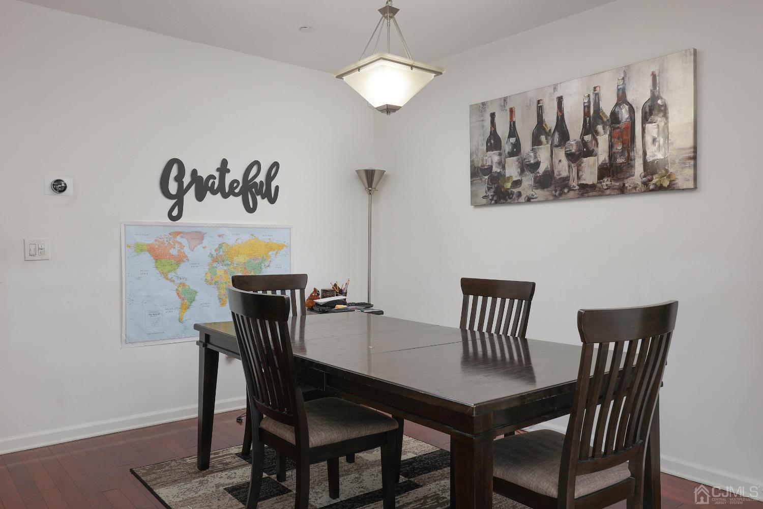 368 Rector Street, Unit 417 Perth Amboy, NJ 08861 - Photo 10 of 27 a view of a dining room with furniture and chandelier