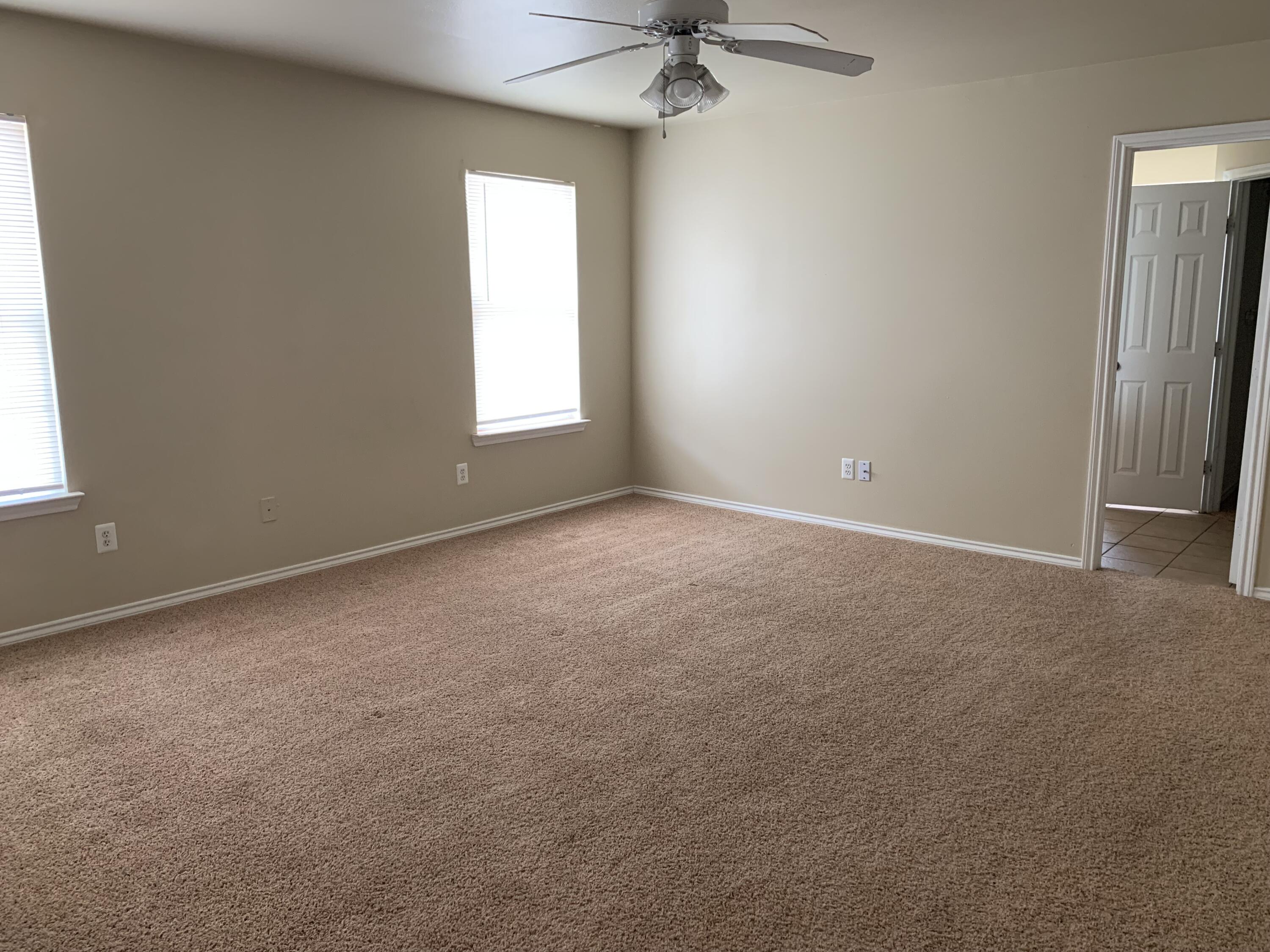 6717 89th Street Lubbock, TX 79424 - Photo 7 of 10 an empty room with a window
