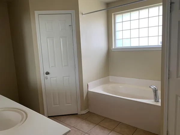 an empty room with a fireplace