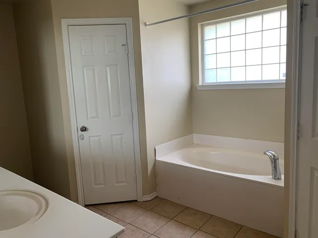 an empty room with a fireplace