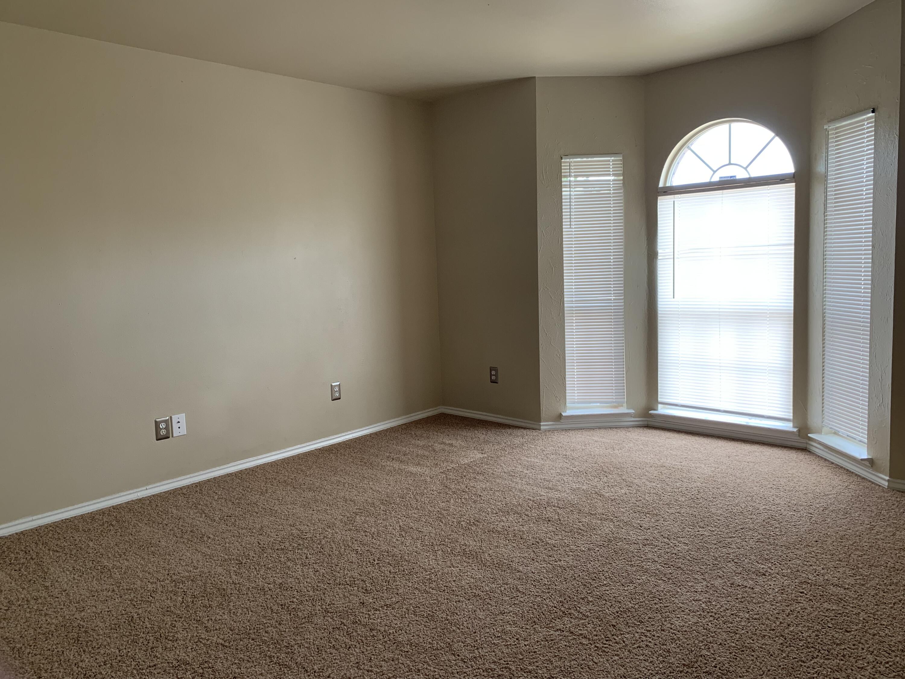6717 89th Street Lubbock, TX 79424 - Photo 10 of 10 an empty room with a window