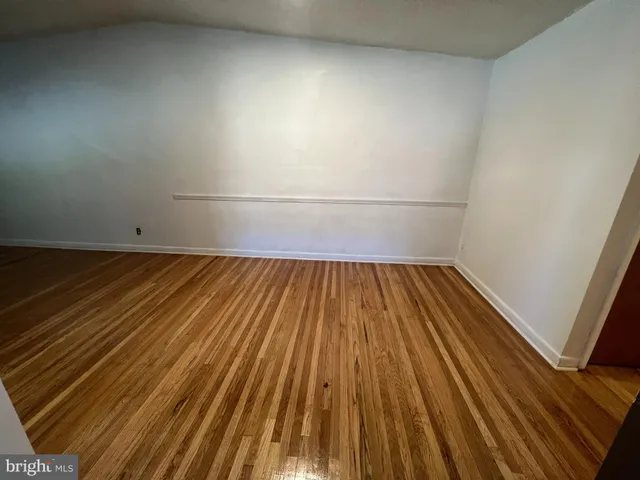 a view of wooden floor in a bathroom