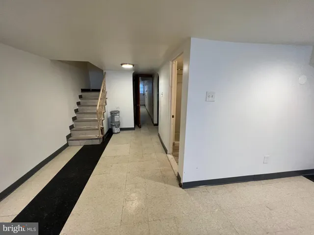 a view of a hallway with stairs