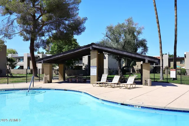 a view of the house with a yard