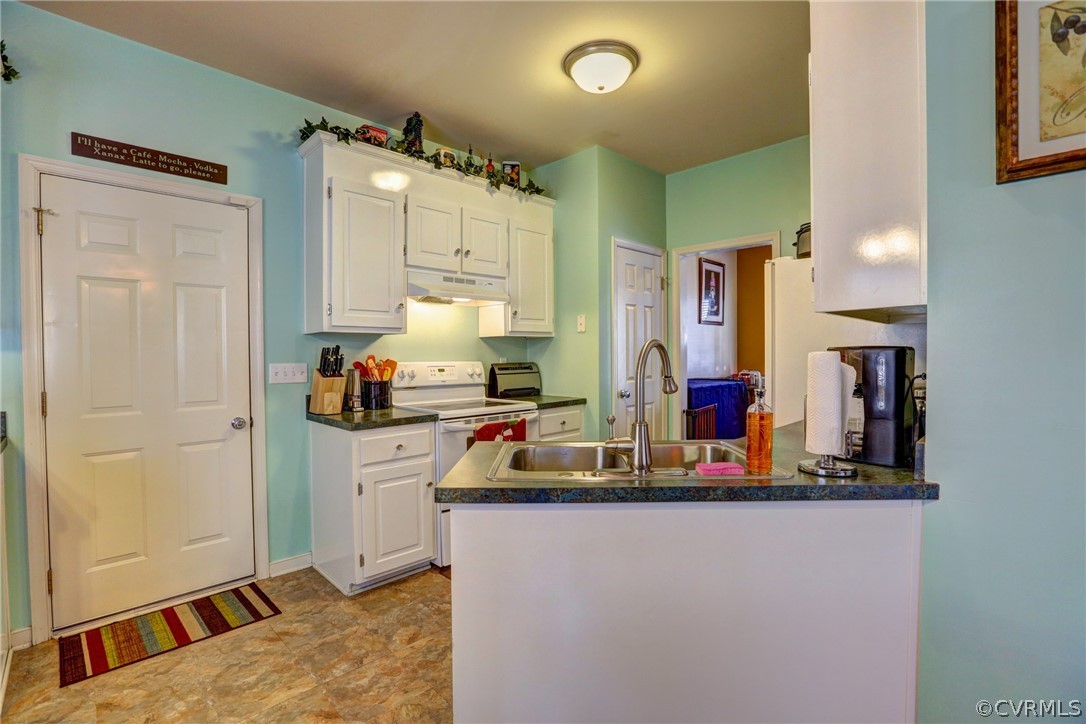 15855 Sandwave Road Chester, VA 23831 - Photo 12 of 42 a kitchen with kitchen island granite countertop a sink cabinets and stainless steel appliances
