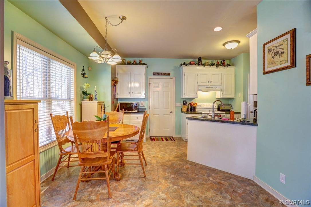 15855 Sandwave Road Chester, VA 23831 - Photo 13 of 42 a dining room with furniture and window