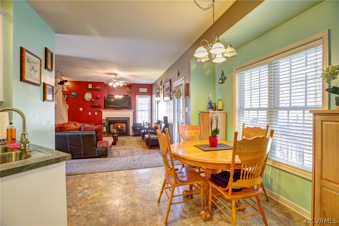 15855 Sandwave Road Chester, VA 23831 - Photo 15 of 42 a dining room with furniture and chandelier