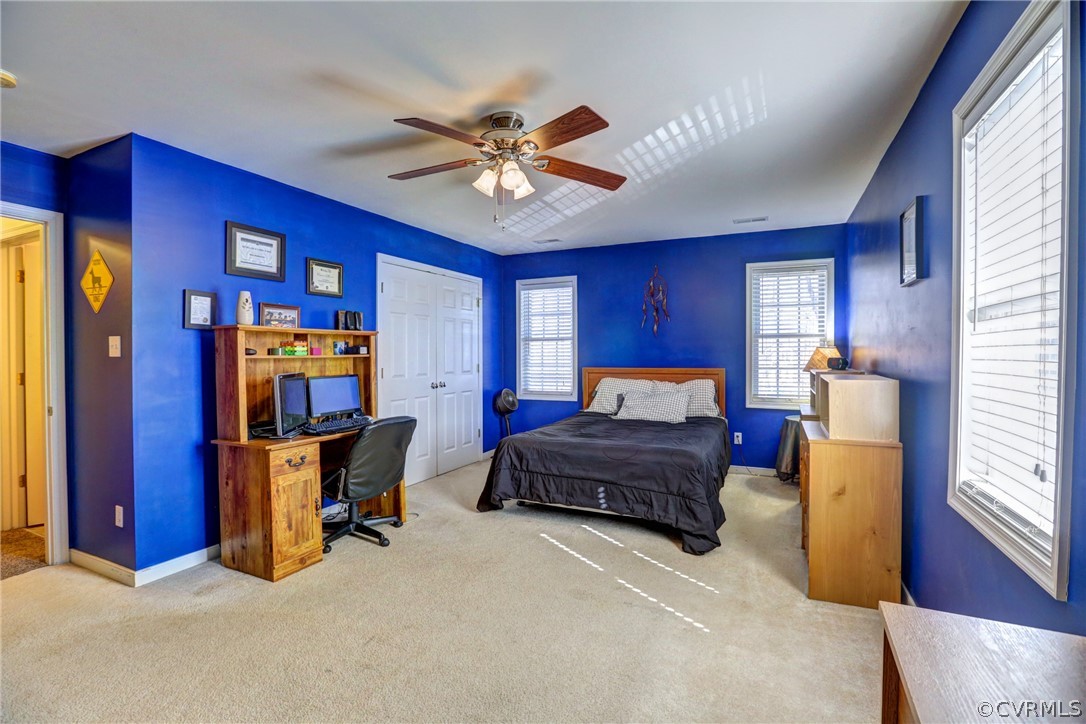 15855 Sandwave Road Chester, VA 23831 - Photo 30 of 42 a bedroom with a bed and wooden floor