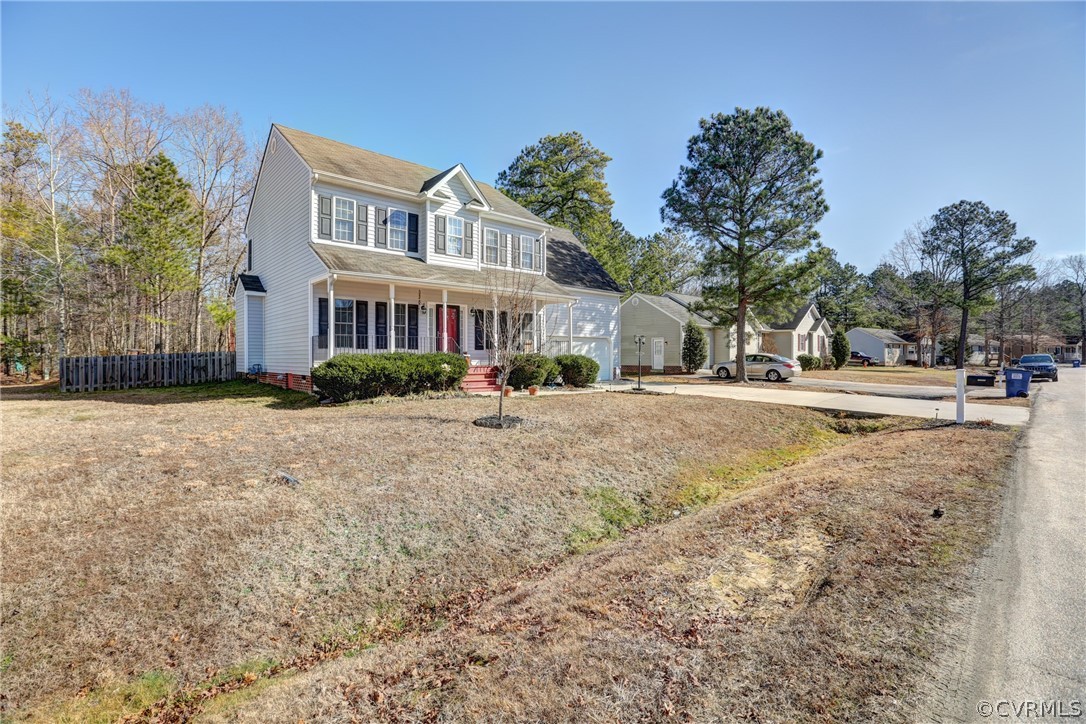 15855 Sandwave Road Chester, VA 23831 - Photo 3 of 42 a view of road with yard and trees